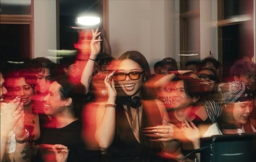 Long-exposure crowd in red light